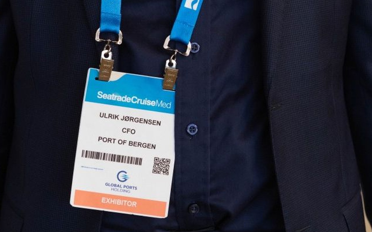 Delegates wearing event badges and lanyards